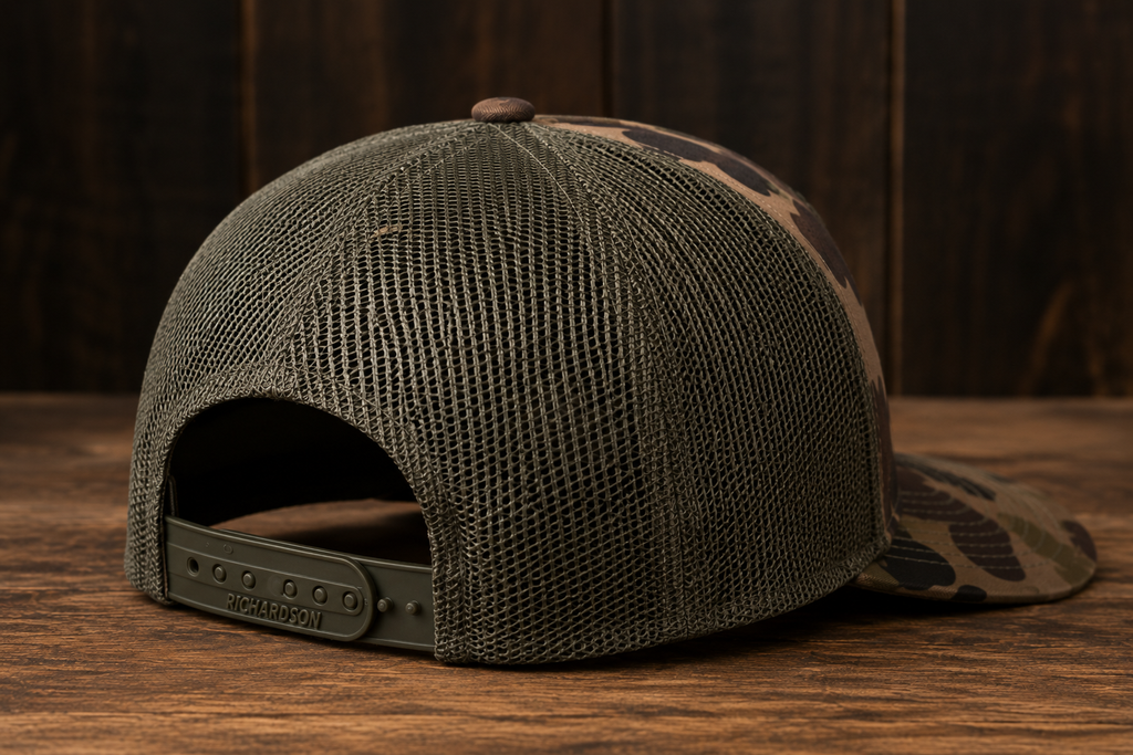 Leather Patch Trucker Hat - Bottomland Camo / Olive