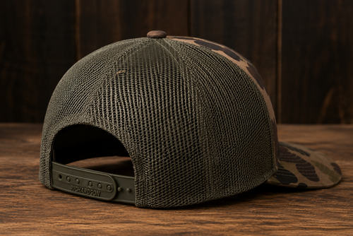 Leather Patch Trucker Hat - Bottomland Camo / Olive